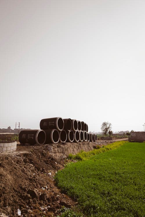Stacked concrete stormwater drainage pipes on a civil site - Ambient Civil Auckland