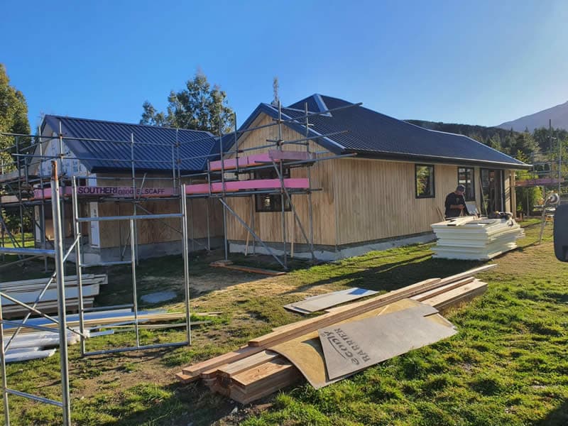 Building under construction with cladding roofing and scaffolding - Ambient Civil Auckland