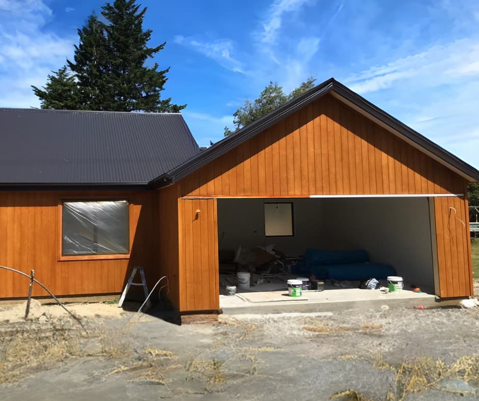 Cedar-clad house and garage under construction on a building site - Ambient Civil Auckland
