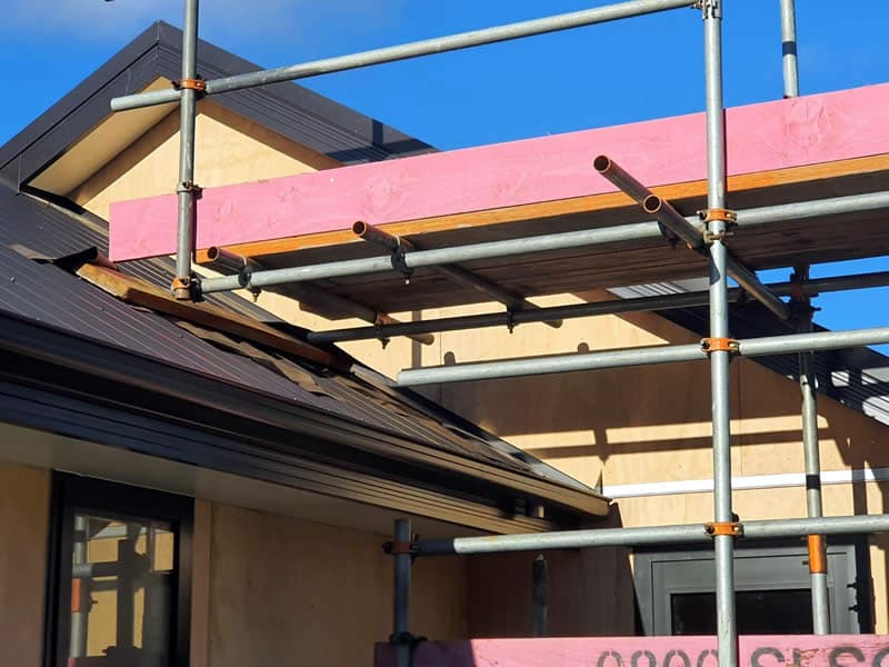 Scaffolding and roofing detail on a building under construction - Ambient Civil Auckland
