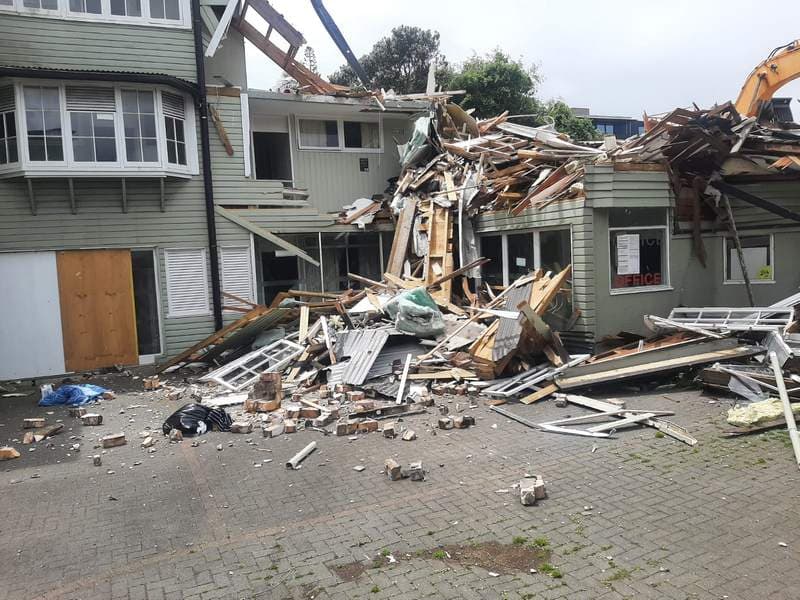 Commercial building mid-demolition with scattered debris in Auckland - Ambient Civil Auckland