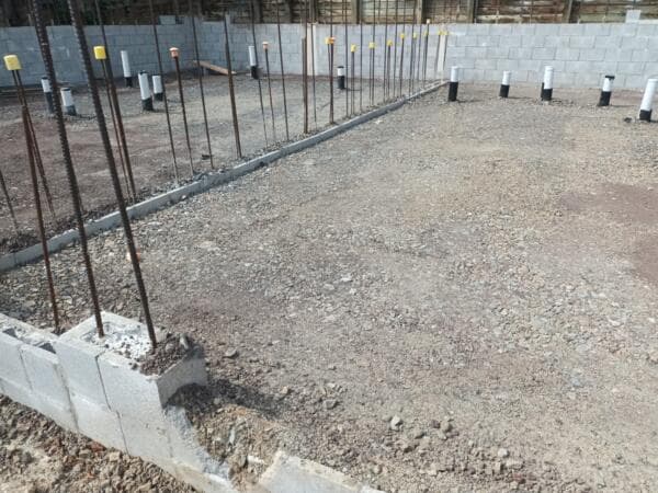 Concrete block foundation wall with rebar starter bars on a prepared platform - Ambient Civil Auckland