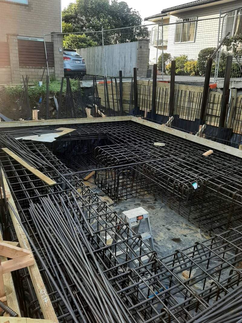 Large reinforced concrete foundation with steel rebar in a residential excavation - Ambient Civil Auckland