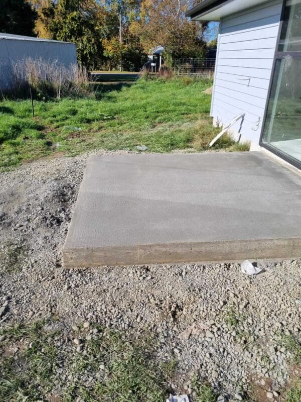 Completed poured concrete slab pad at rear of a house - Ambient Civil Auckland