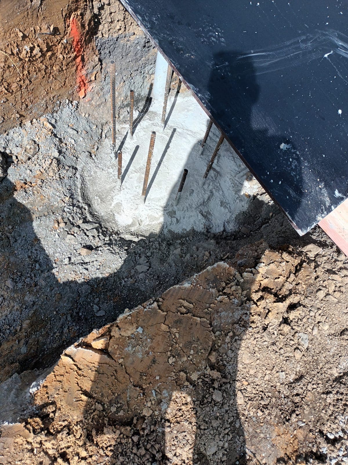 Concrete footing pad with protruding starter bars on a building site - Ambient Civil Auckland