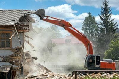 Excavator demolishing a residential house in Auckland - Ambient Civil Auckland
