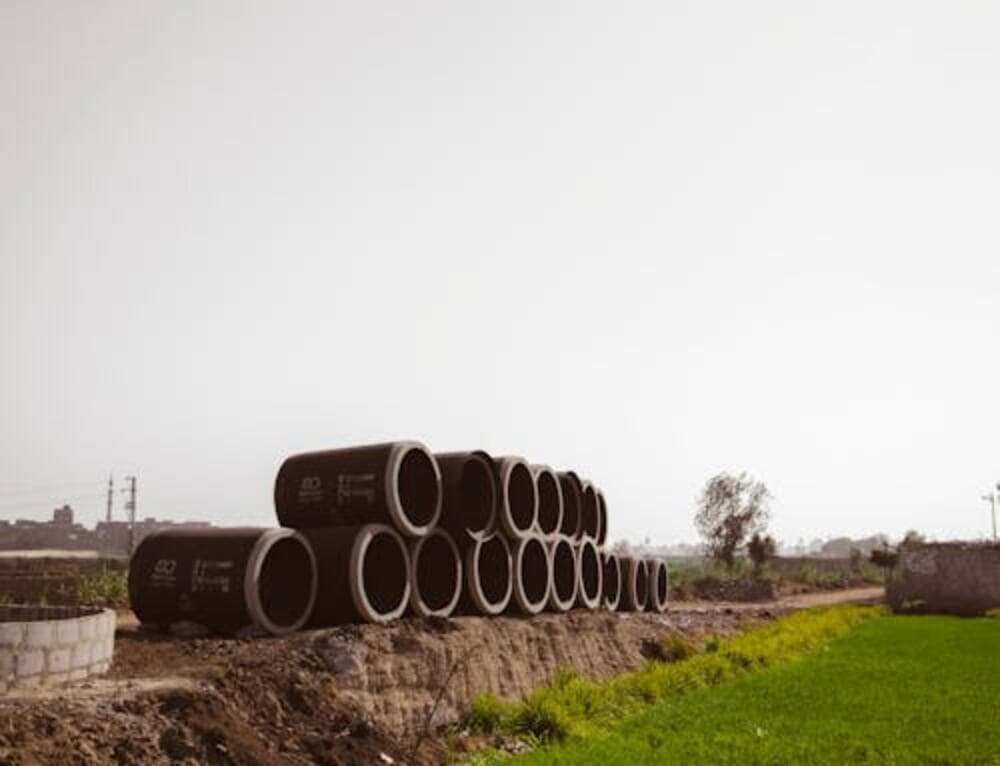 Concrete stormwater drainage pipes stacked on site - Ambient Civil Auckland