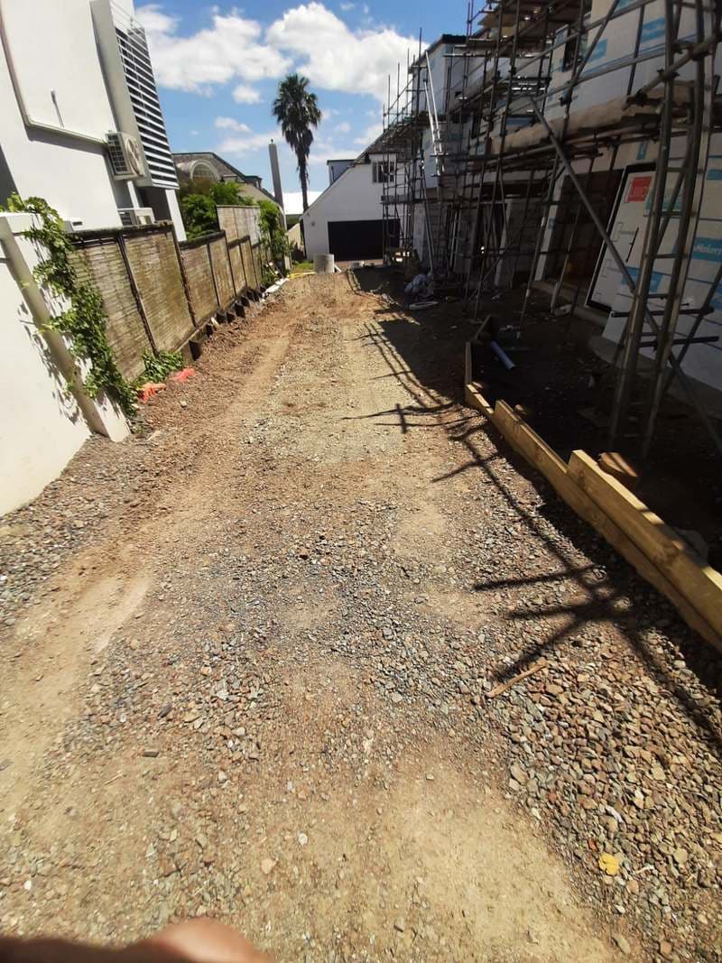 Compacted gravel driveway base preparation on a building site - Ambient Civil Auckland