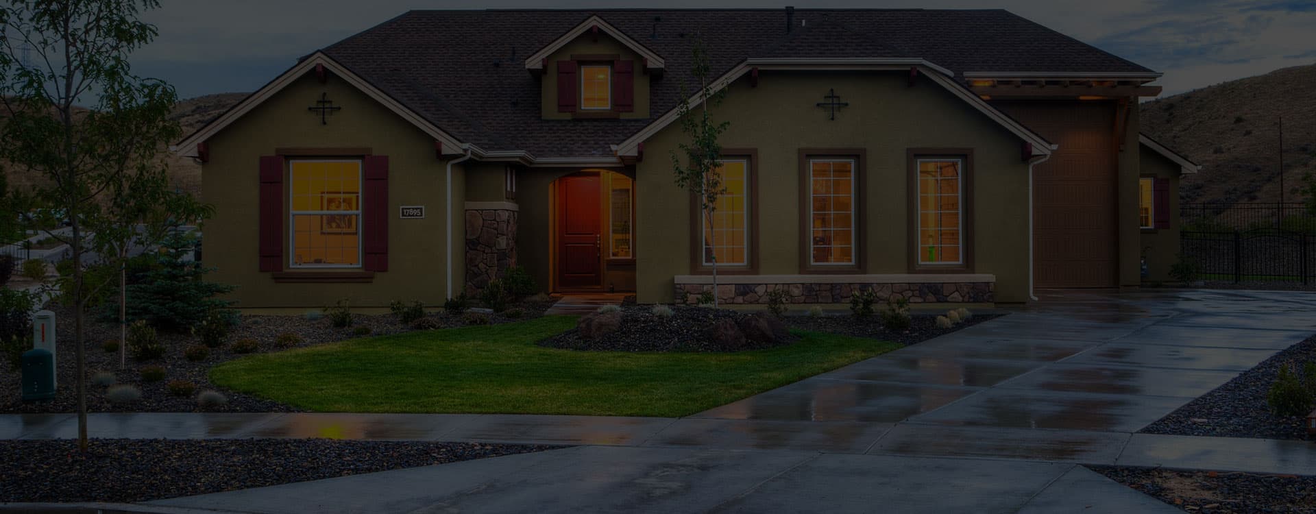 Finished concrete driveway in front of a completed home - Ambient Civil Auckland