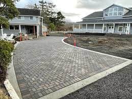 Freshly laid paver driveway with concrete edging - Ambient Civil Auckland