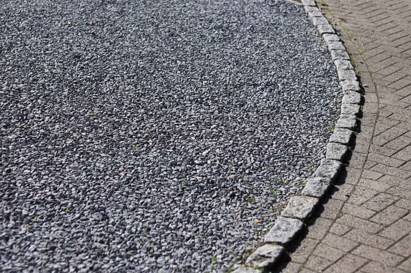 Grey shingle gravel driveway with cobble edging - Ambient Civil Auckland