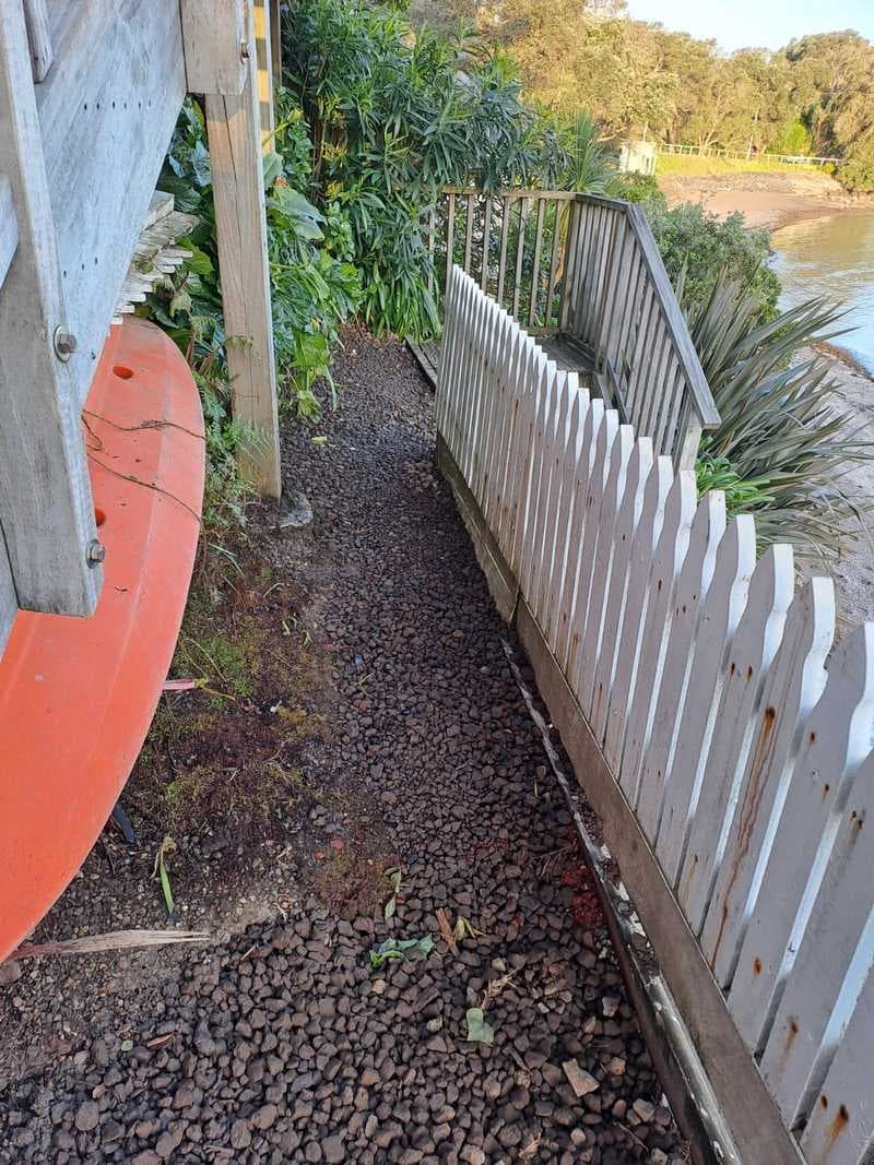 New gravel path and white picket fence at a coastal property - Ambient Civil Auckland
