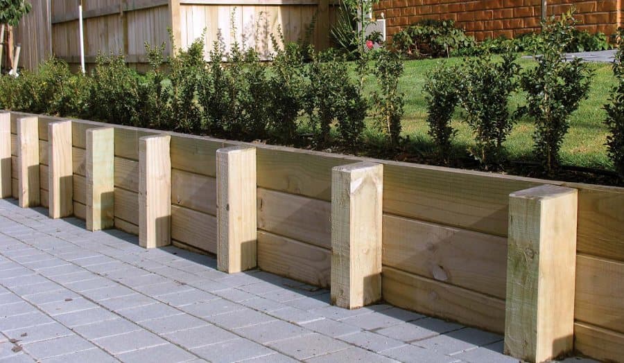 Finished timber sleeper retaining wall with garden bed - Ambient Civil Auckland