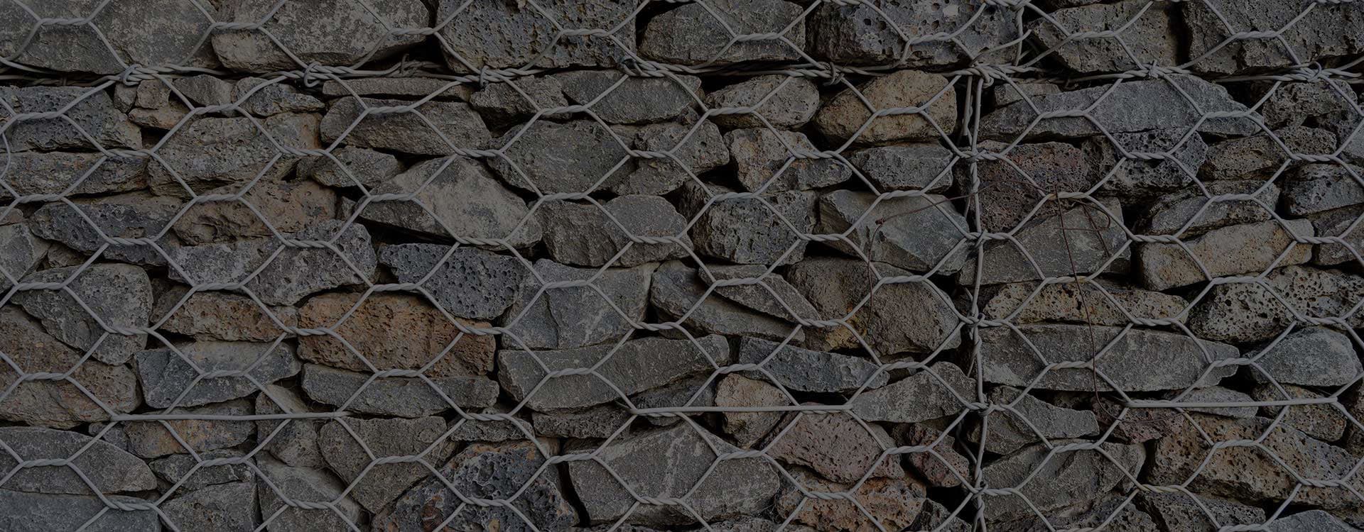 Close-up of gabion basket wire mesh and stone fill - Ambient Civil Auckland