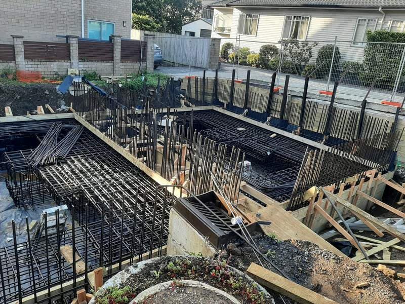 Deep reinforced concrete retaining wall structure with steel starter bars on an Auckland site - Ambient Civil Auckland