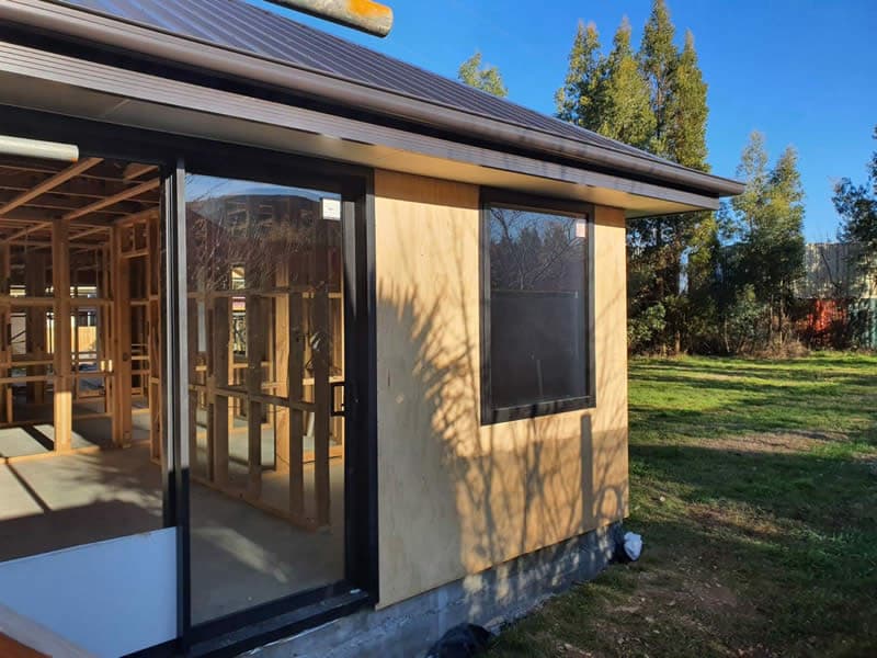 Single-storey building under construction with timber framing and plywood cladding - Ambient Civil Auckland