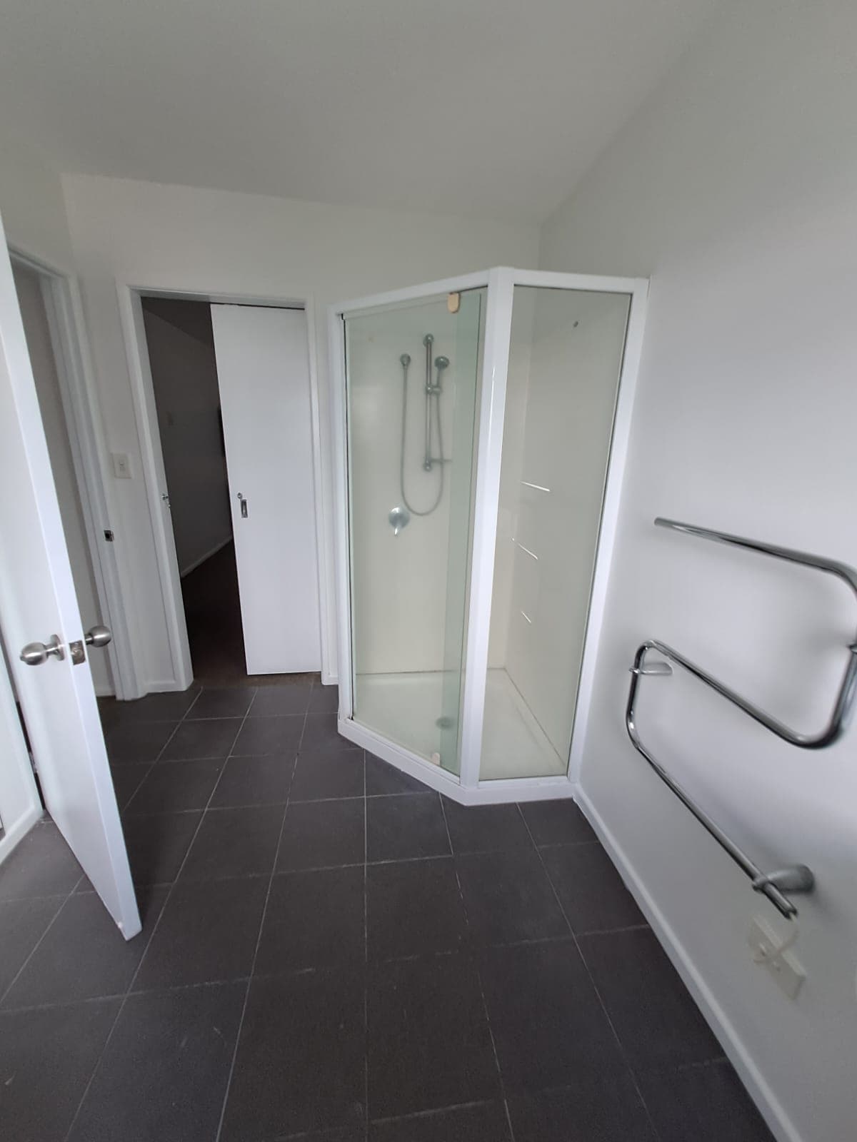 Freshly painted ensuite bathroom with glass shower and tiled floor - Ambient Civil Auckland