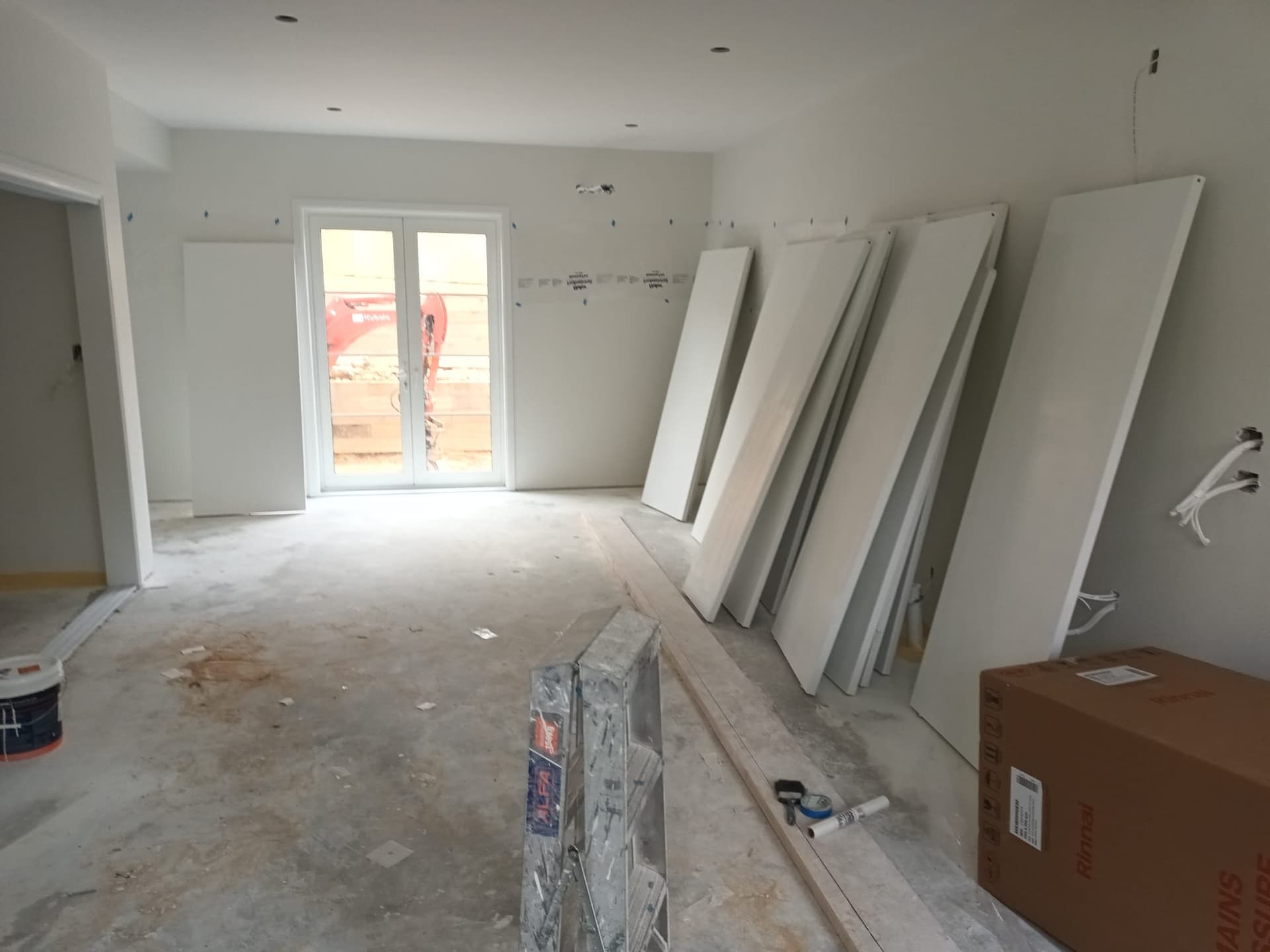 Open-plan room during wall lining and plasterboard installation in a new build - Ambient Civil Auckland